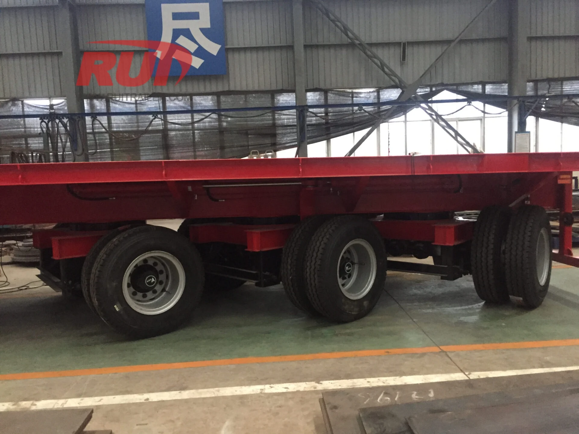 Team inspecting trailer manufacturing process