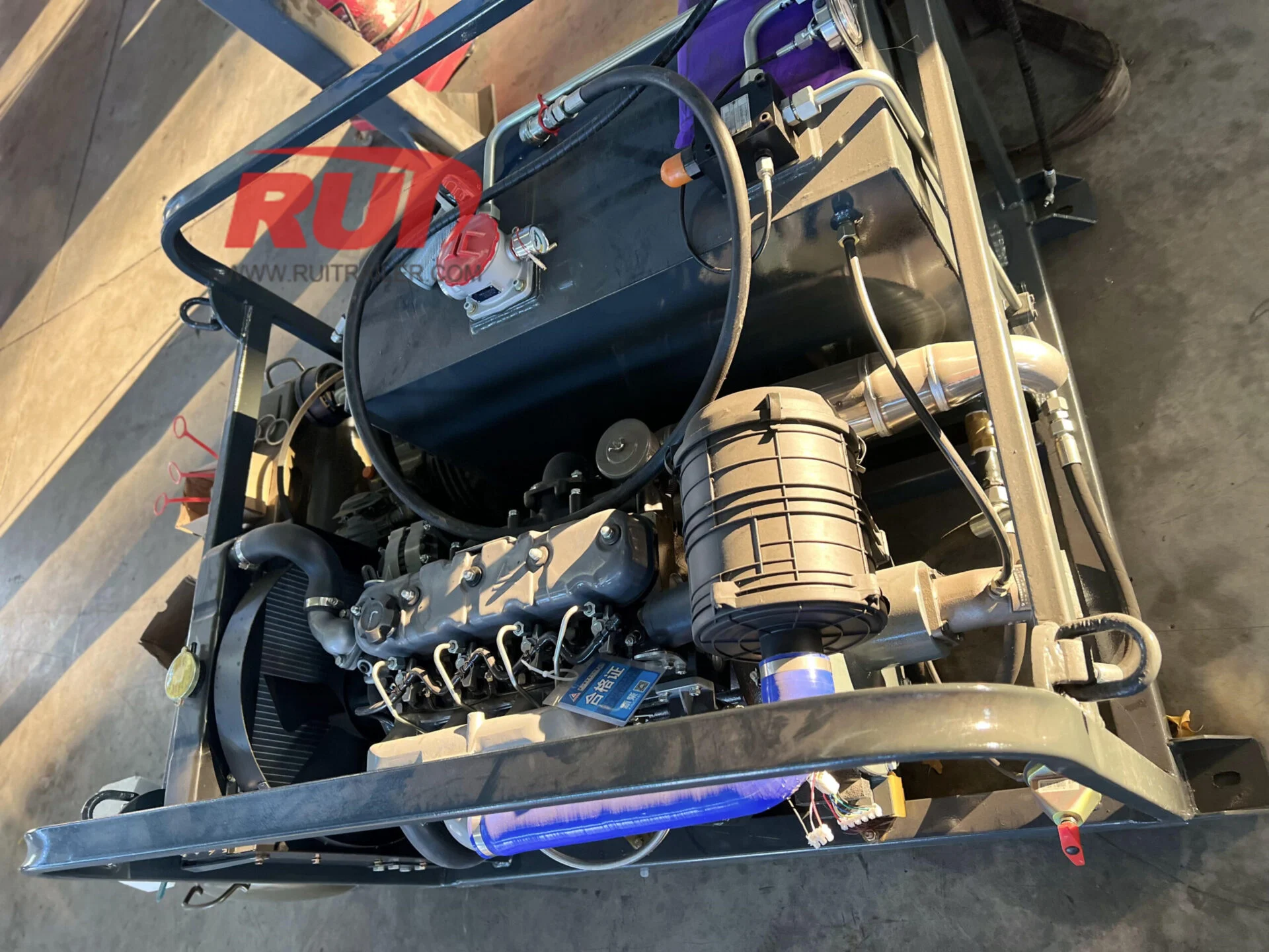 Specialty trailer transporting tractor