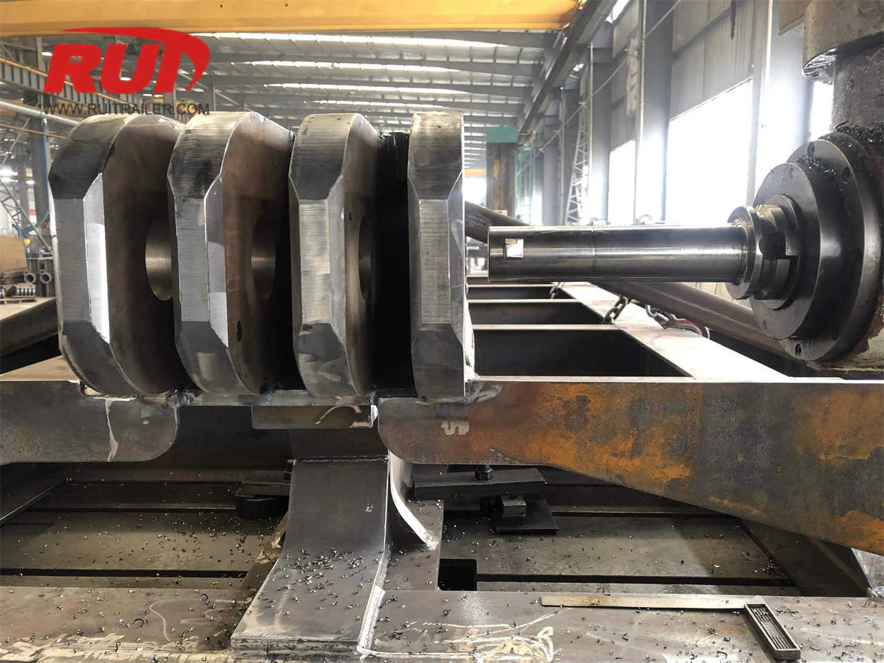 CNC gantry milling machine processing large scale heavy duty hydraulic modular trailer chassis frame with unified clamping datum setup