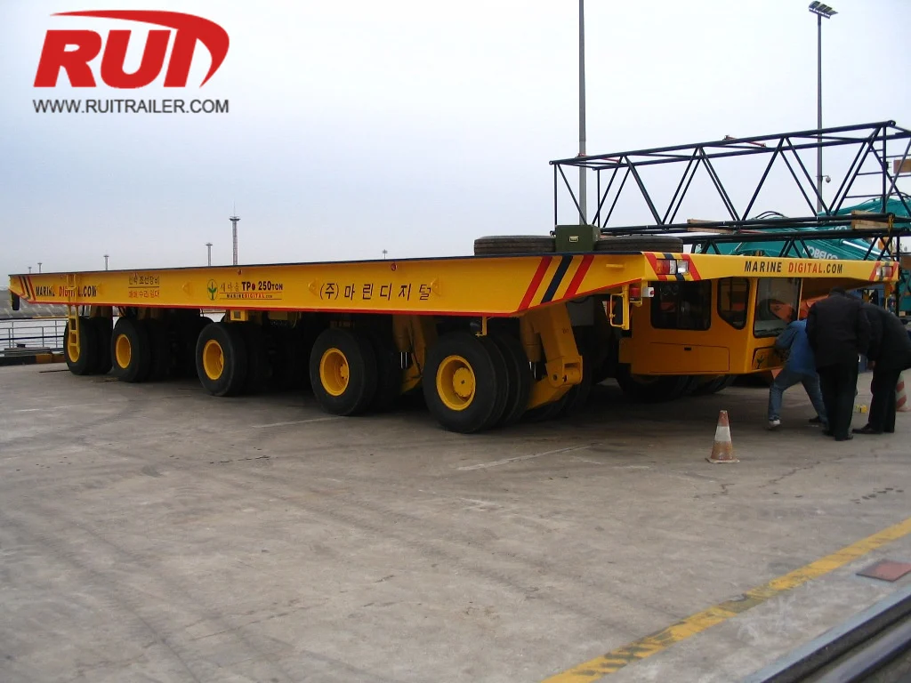 SPMT transporting ship module inside shipyard