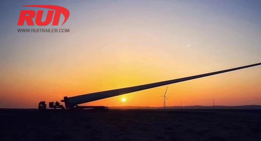 wind turbine blade transport with rotor blade adaptor