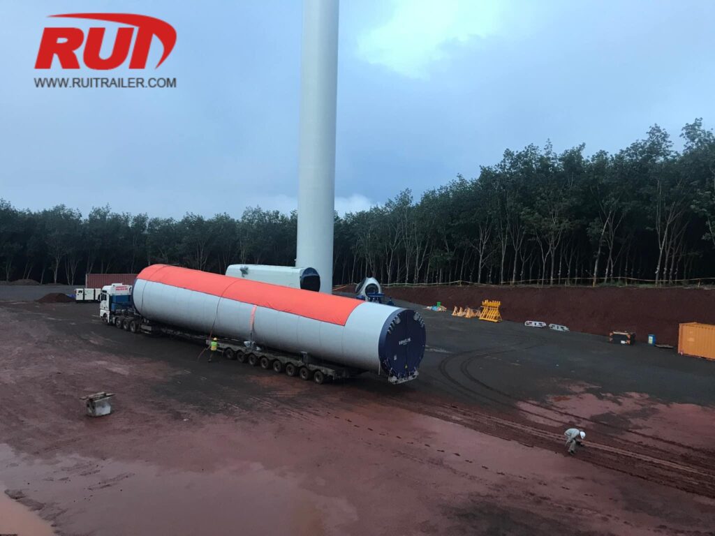 tower sections transport by extendable trailer